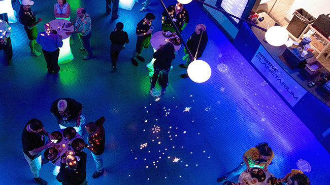 Visitors to the INTUITIVE® Planetarium enjoys refreshments in the lobby