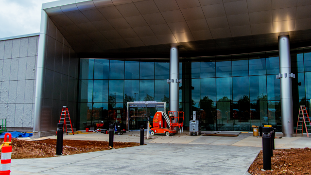Construction equipment, cones, and ladders sit outside the Space Camp Operations Center